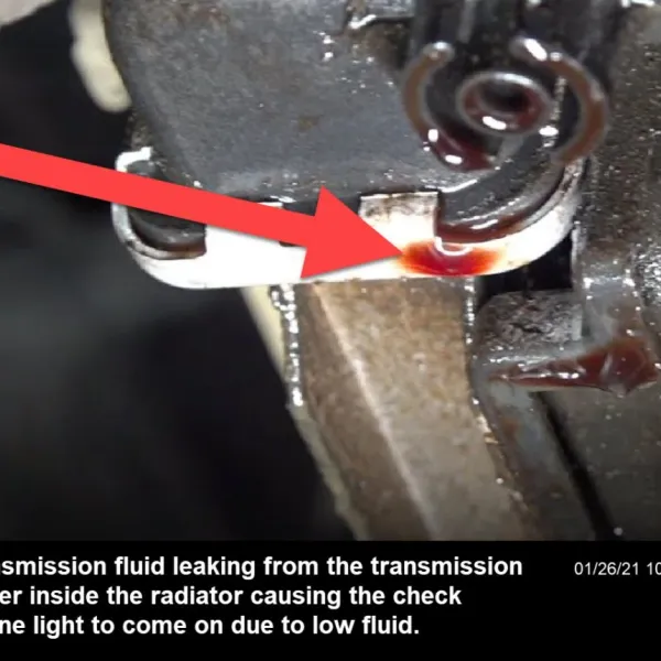 The check engine light is popping up because of a transmission fluid leak around the transmission cooler