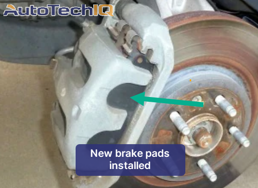 Picture of brand new brake pads installed on a rotor
